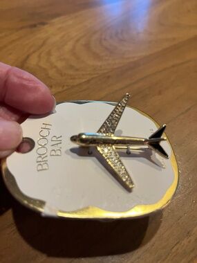 Anthropologie Gold and Black Airplane Pin